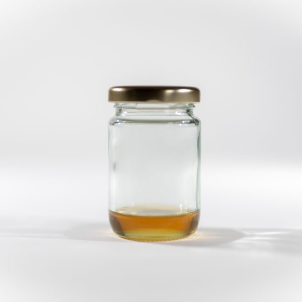 portrait shot of dushey 80% broad spectrum cbd distillate 1kg on white background